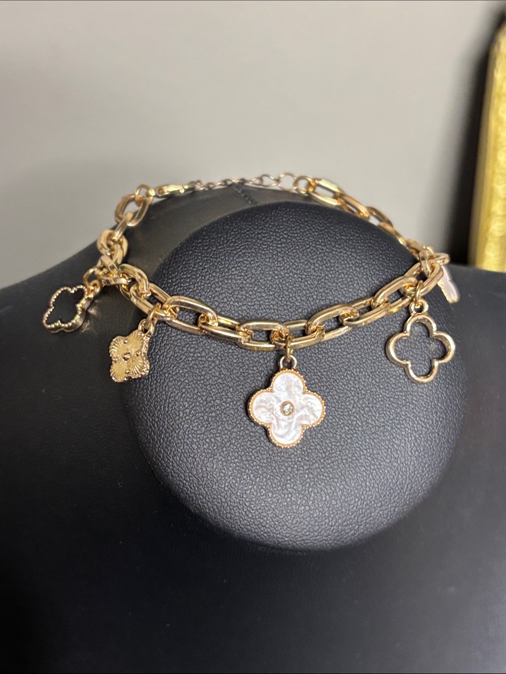 Gold Tone Clover Charm Bracelet with White Enamel Accents